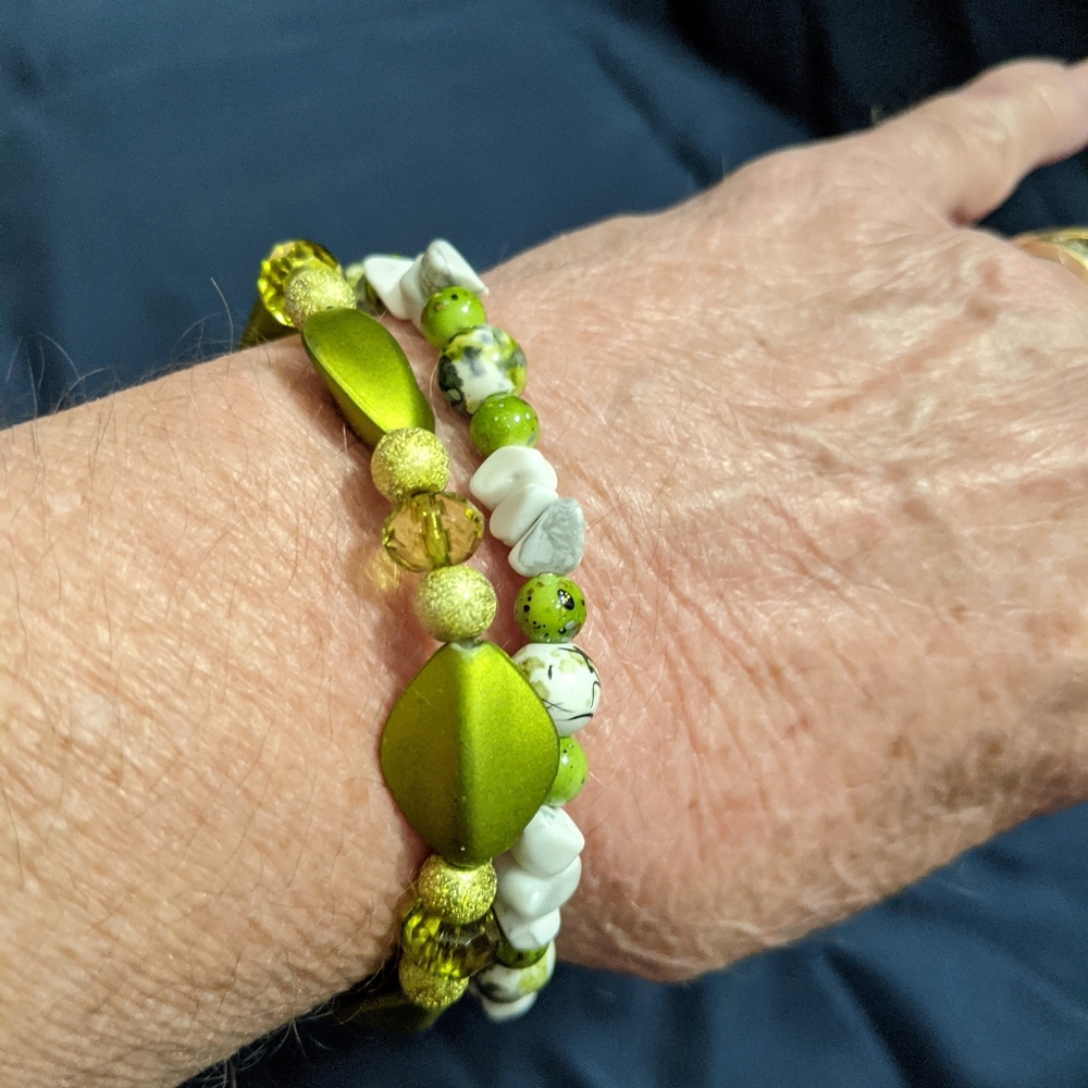 Pair of green and white bracelets